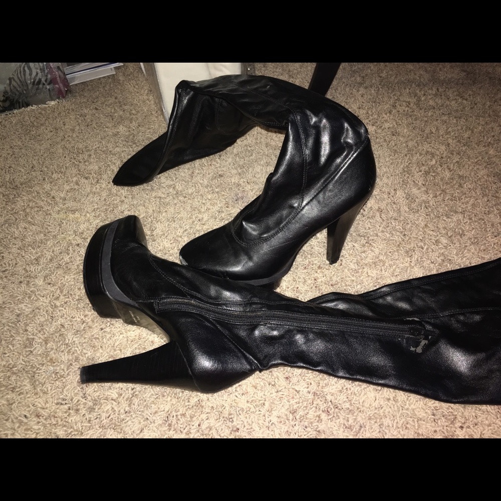 Thigh high leather heeled boots